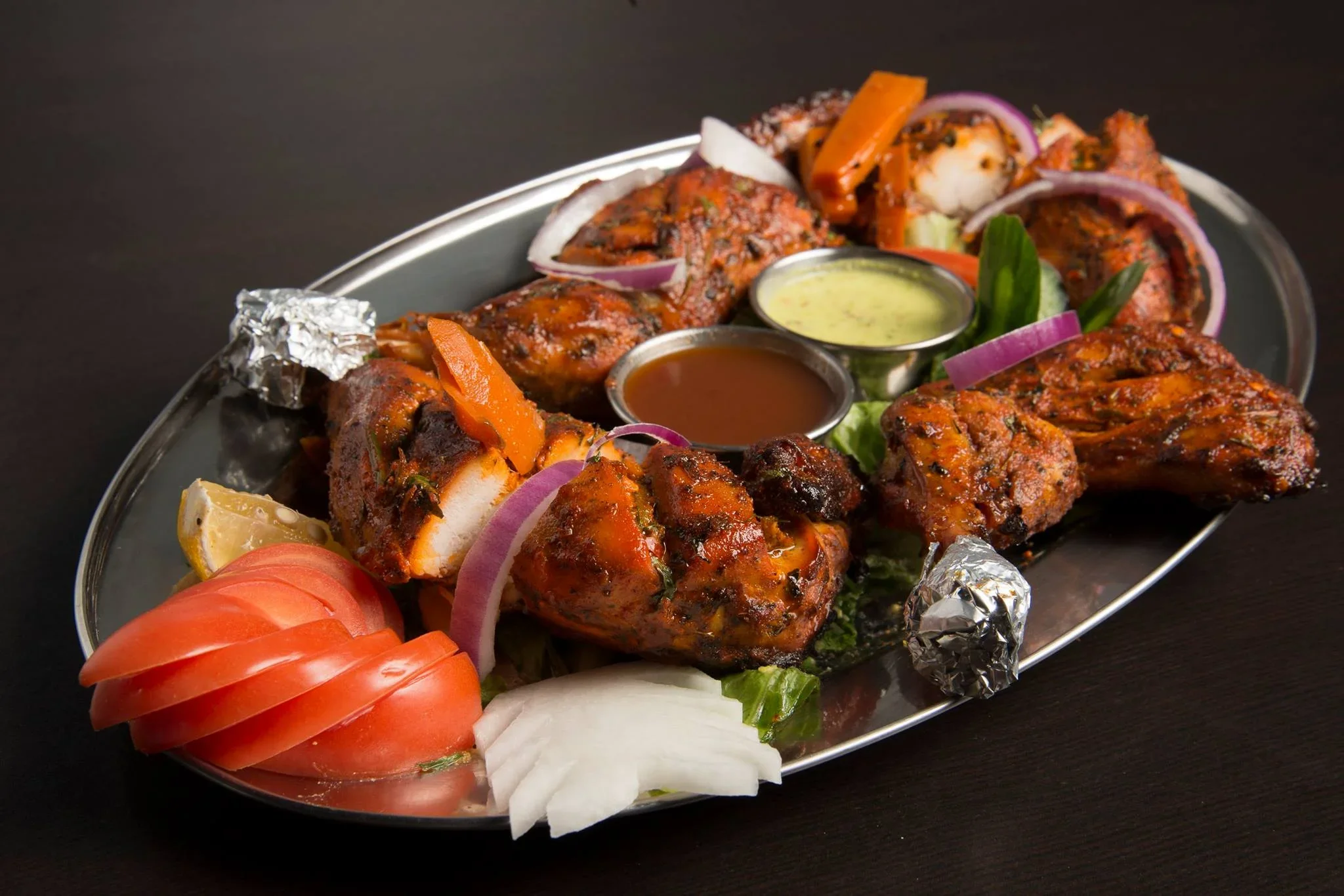 Popular Indian dishes for delivery from Tandoor House - Butter Chicken, Tandoori Chicken, Chicken Biryani